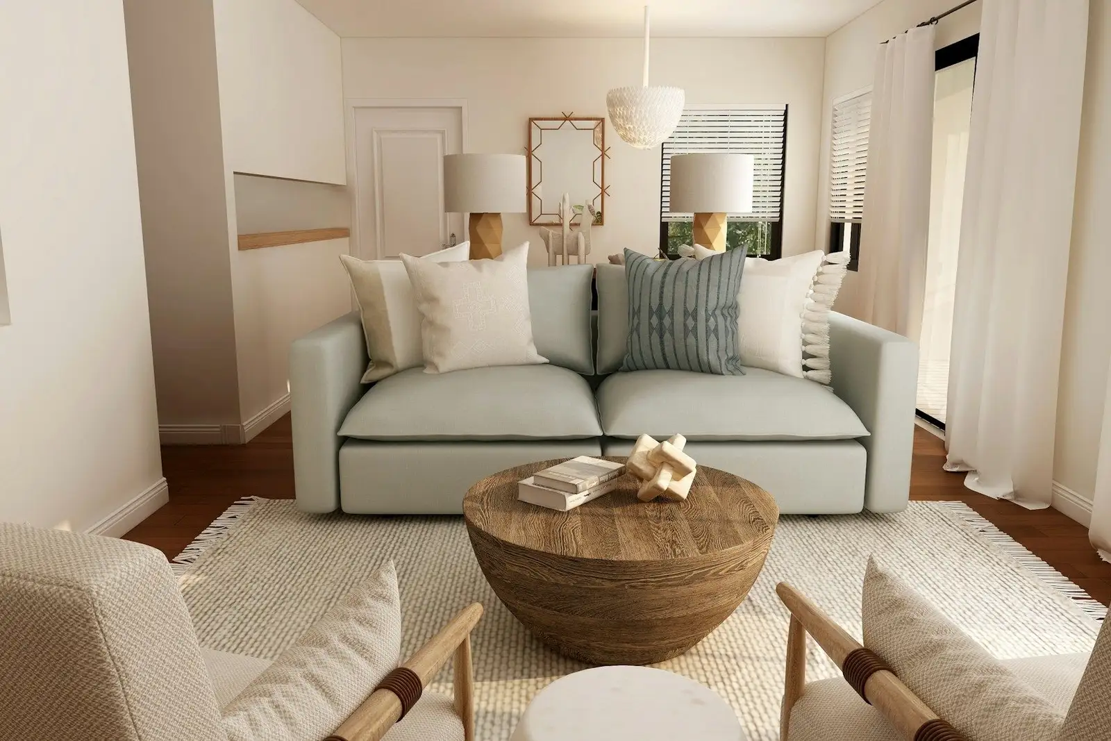 Living room with a pale sofa, a round wooden table and two armchairs