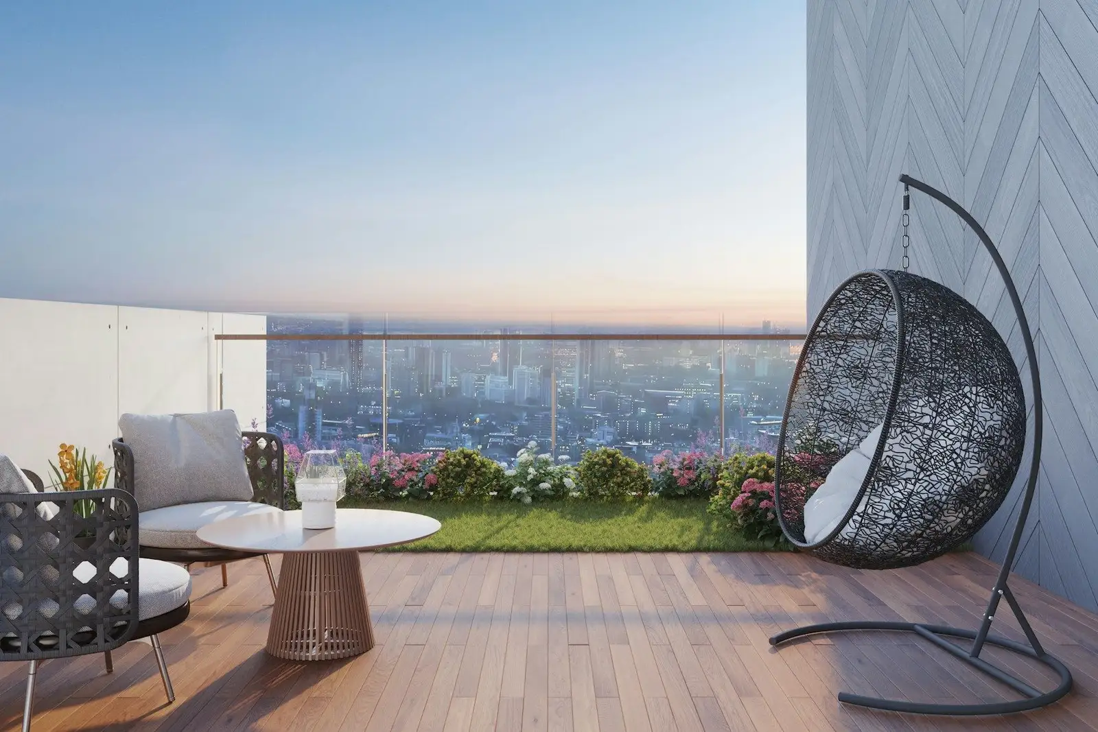 Balcony with lounge chairs, a hanging chair and a city view