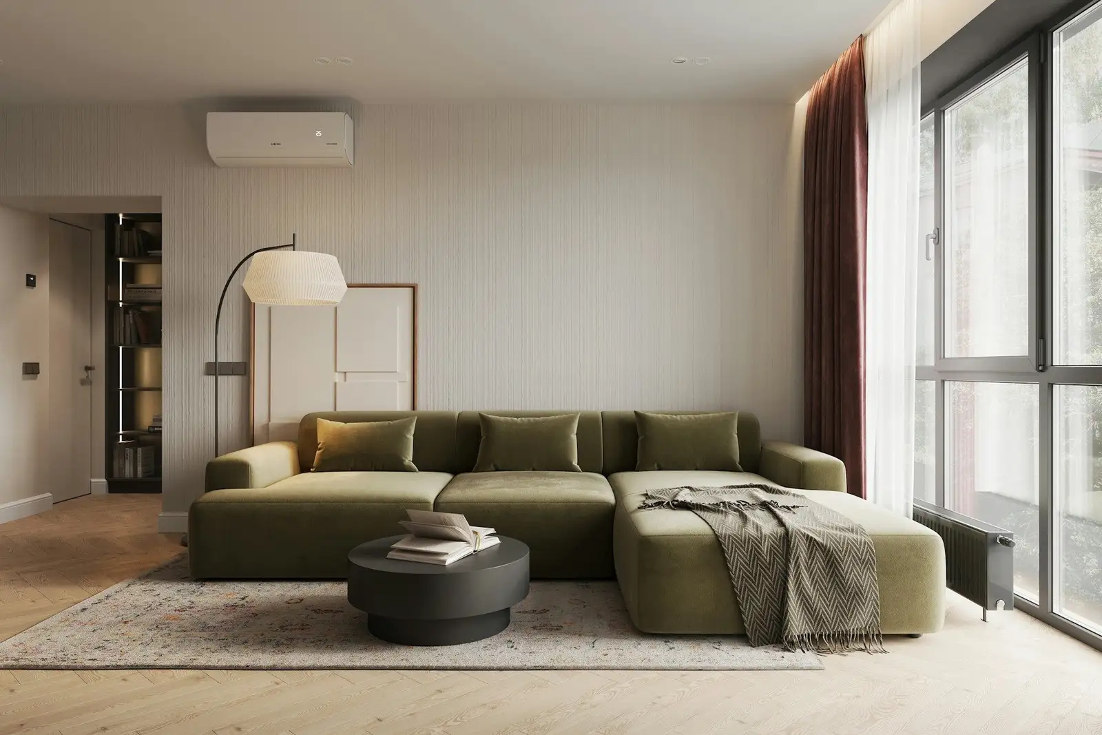Living room with a green sectional sofa and floor-to-ceiling windows