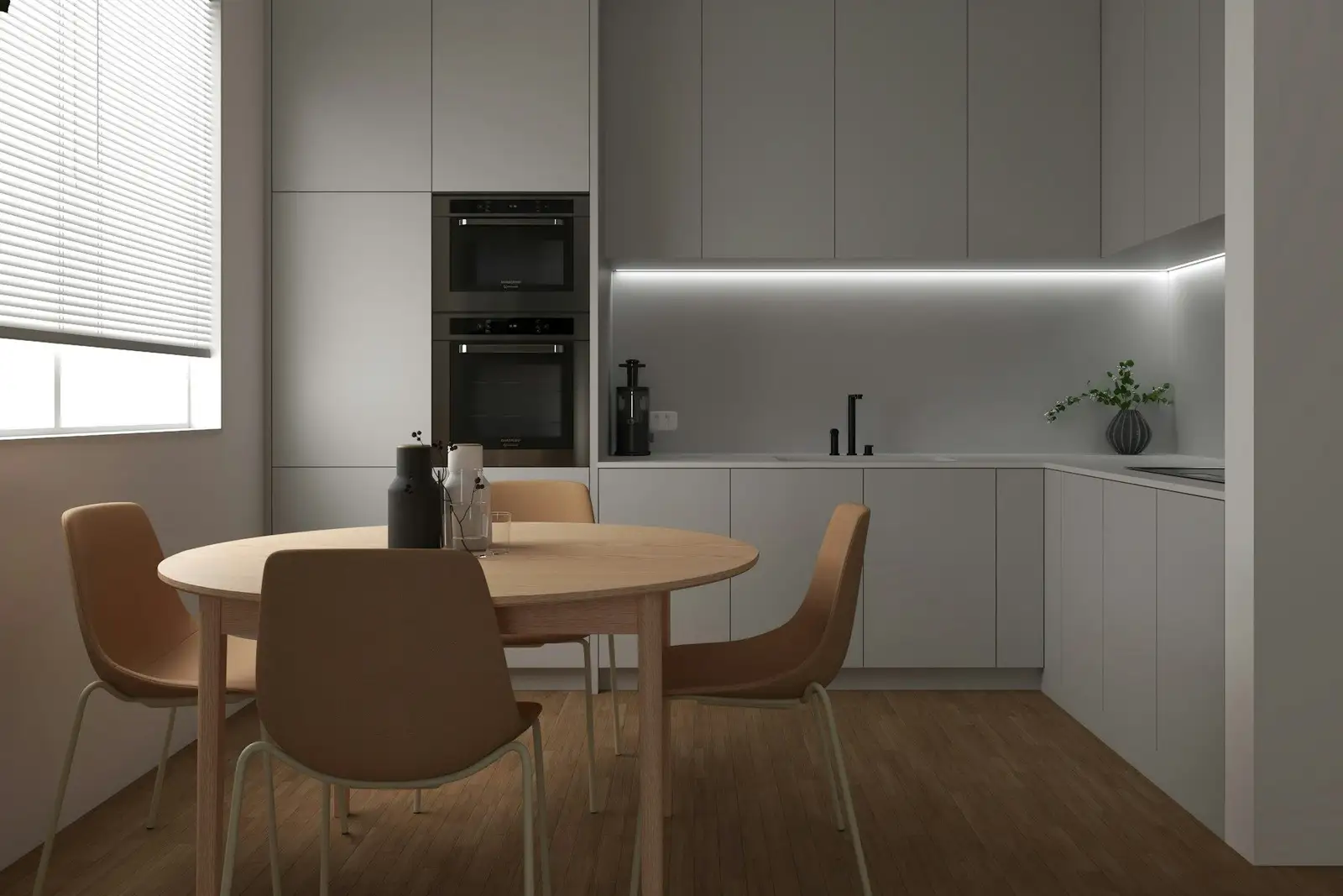 Grey kitchen with a round dining table and four chairs